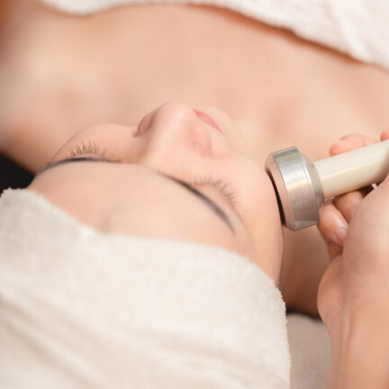 Closeup of unrecognizable woman posing against a white studio background. One female only feeling c.