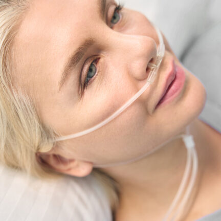 Closeup of unrecognizable woman posing against a white studio background. One female only feeling c.