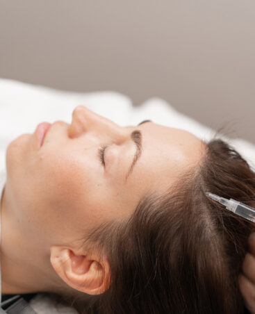 Closeup of unrecognizable woman posing against a white studio background. One female only feeling c.