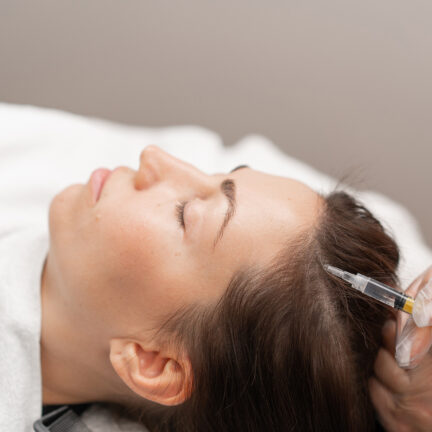 Closeup of unrecognizable woman posing against a white studio background. One female only feeling c.