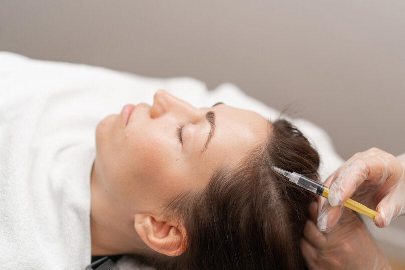 Closeup of unrecognizable woman posing against a white studio background. One female only feeling c.
