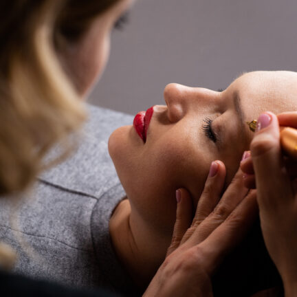 Closeup of unrecognizable woman posing against a white studio background. One female only feeling c.