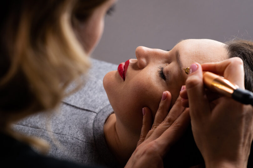 Closeup of unrecognizable woman posing against a white studio background. One female only feeling c.
