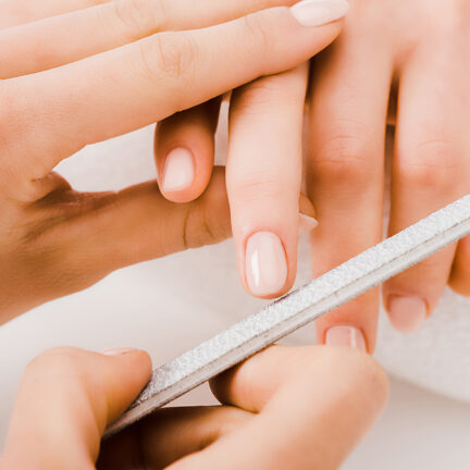 Closeup of unrecognizable woman posing against a white studio background. One female only feeling c.