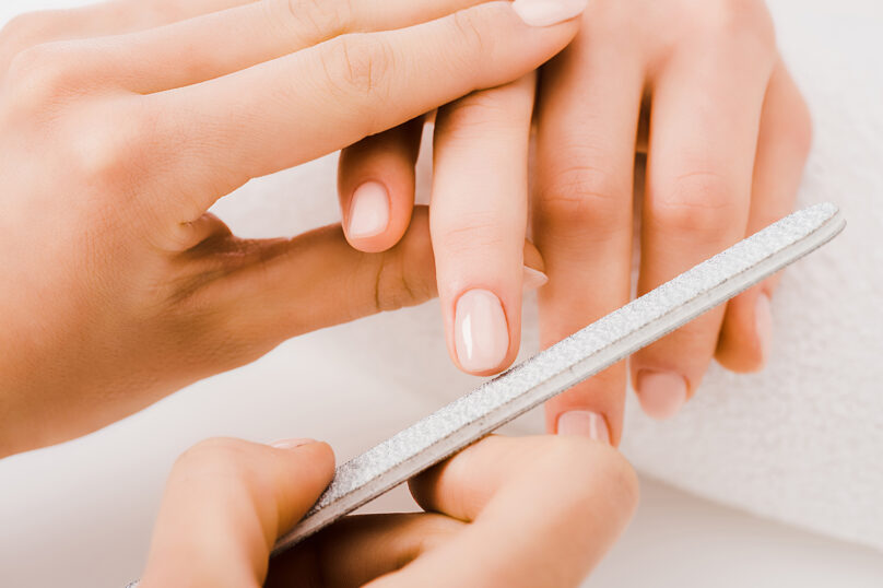Closeup of unrecognizable woman posing against a white studio background. One female only feeling c.