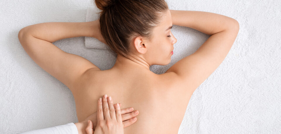 Closeup of unrecognizable woman posing against a white studio background. One female only feeling c.