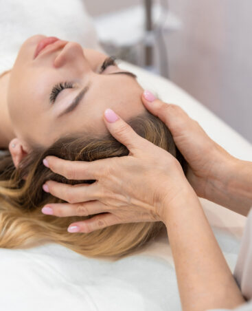 Closeup of unrecognizable woman posing against a white studio background. One female only feeling c.