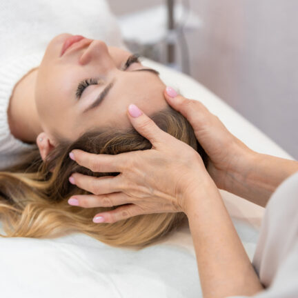 Closeup of unrecognizable woman posing against a white studio background. One female only feeling c.