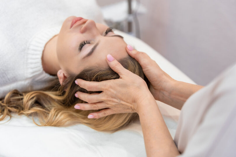 Closeup of unrecognizable woman posing against a white studio background. One female only feeling c.