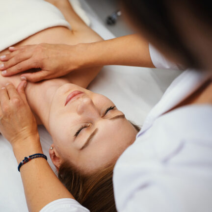 Closeup of unrecognizable woman posing against a white studio background. One female only feeling c.