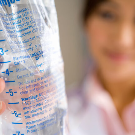 Closeup of unrecognizable woman posing against a white studio background. One female only feeling c.