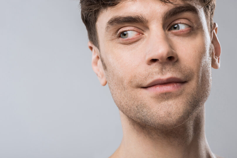 Closeup of unrecognizable woman posing against a white studio background. One female only feeling c.