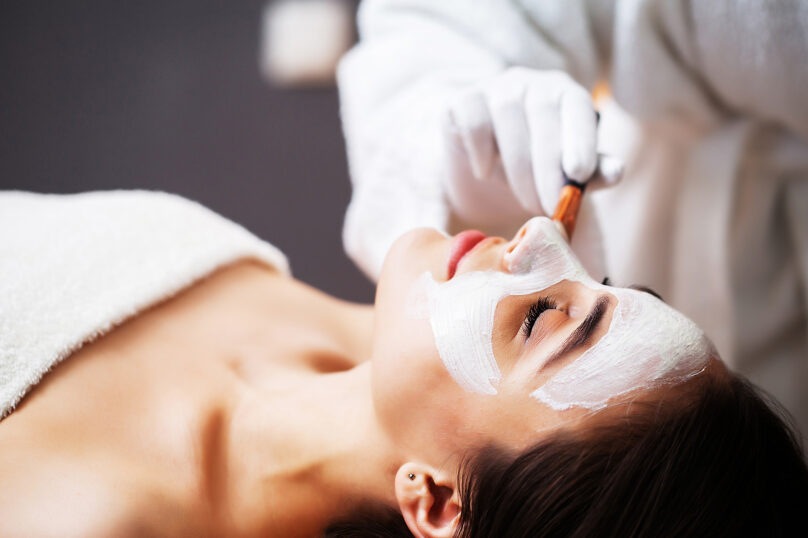 Closeup of unrecognizable woman posing against a white studio background. One female only feeling c.